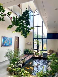 a room with a koi pond in the floor at Homestay SkyLight in Dong Hoi