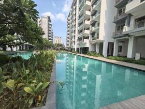 a swimming pool in the middle of a building at Axis Residences Apartment in Phnom Penh