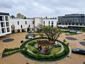 a building with a park with a tree in the middle at 410 On Park in Cape Town