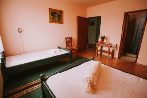 Postel nebo postele na pokoji v ubytování Bosnyák Panzió