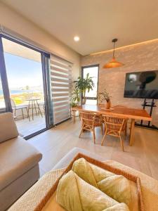 a living room with a couch and a table at Wabi Sabi in Rosarito