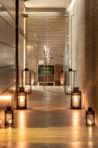 a lobby of a building with lights on the floor at Meliá Genova in Genoa