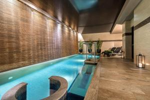 a swimming pool in a hotel room at Meliá Genova in Genoa