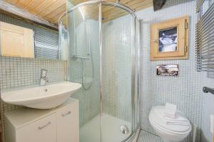 a bathroom with a shower and a sink and a toilet at Rustico Caterina - Corippo- Happy Rentals in Corippo