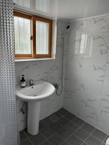 a bathroom with a sink and a shower at Seoungho Kim in Ch'ŏngsap'o +41 photos