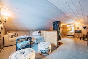 a living room with a couch and a table at Gamatun cabin in Heimdal