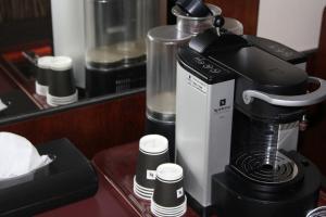 a coffee maker on a counter in a room at Hotelli Gustavelund in Tuusula +12 photos