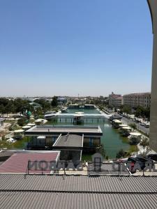 a view of a marina with boats in the water at GRAND SARBON HOTEL in Qarshi