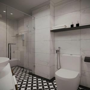 a bathroom with a toilet and a glass shower at Market Ben Thanh Kas Hotel Passion in Ho Chi Minh City