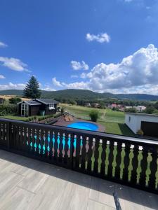 a view of the backyard from the balcony of a house at Ferienwohnung am Tor zum Thüringer Wald in Plaue