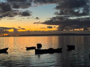 a group of boats sitting in the water at sunset at Casa Maria in Matzaccara +4 photos