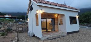 a small house with a porch and a door at Dara House Private Pension in Jangheung +22 photos
