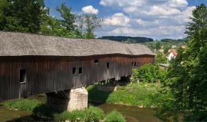 a large wooden bridge over a river at Best Western Hotel Am Straßberger Tor in Plauen