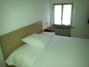 Un pat sau paturi într-o cameră la Riva San Vito 2