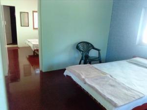 Postel nebo postele na pokoji v ubytování Hotel Anjali Lodge Malvan