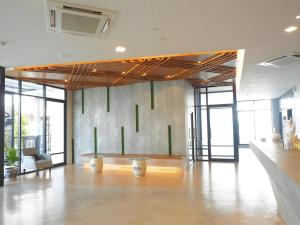 a large room with a table in the middle of it at Sans Hotel in Ban Rong Chang