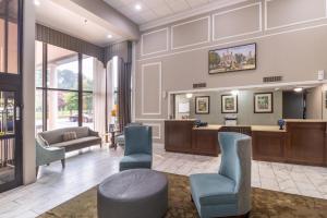 a waiting room with a waiting desk and chairs at Quality Inn & Suites in Williamsburg