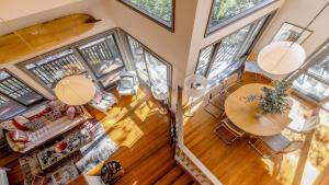 an overhead view of a living room with a table at Coastal Wilderness Retreat in Hardys Bay