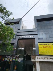 a building with a sign on the side of it at Hotel Privilln in Ahmedabad
