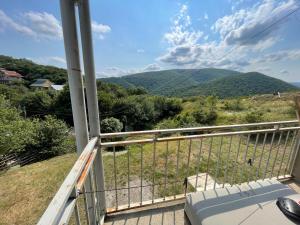 a balcony with a view of a mountain at Mukha in Tbilisi City