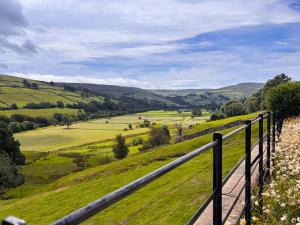 a view of the hills from a fence at Windy Ridge Low Row in Feetham