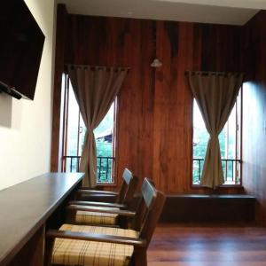 a conference room with chairs and a table and windows at Phumin Place Hotel in Nan +74 photos