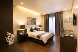 Postel nebo postele na pokoji v ubytování Lenox Hotel + 22 fotografií