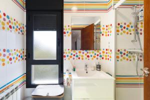a bathroom with a sink and a mirror at Villa Ana Esperanza - El Espinar in El Espinar +30 photos