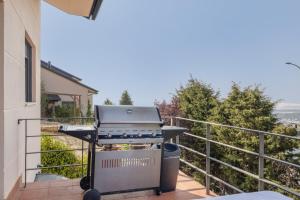 a grill on the balcony of a house at Villa Ana Esperanza - El Espinar in El Espinar