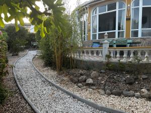 a house with a train track in front of it at Villa Carmen in Torrox Costa