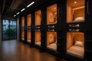a locker room with a row of shelves at OWNLY CAPSULE Hotel in Bangkok