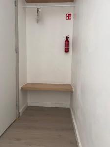 a room with a shelf and a fire hydrant on a wall at Modern private Rooms with attached Bathroom & Free Parking in Bruges +15 photos