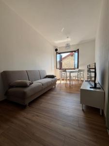 a living room with a couch and a table at Sotto il castello in Borno