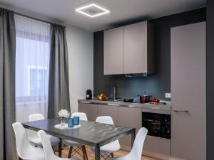 a kitchen and dining room with a table and chairs at Premium apartment in Schwaz in Schwaz