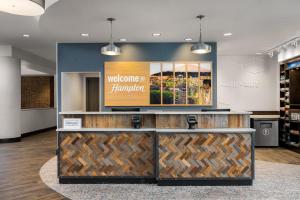 a lobby with a welcome to komodo kambulator sign at Hampton Inn & Suites Memphis Germantown in Memphis +31 photos