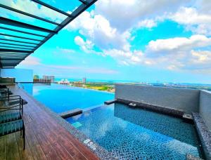 a swimming pool on the roof of a building at 2BR Infinity Pool Condo Near Jonker 5Pax in Malacca