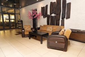 a lobby with a couch and chairs and a table at Everest Hotel in Etropole +67 photos