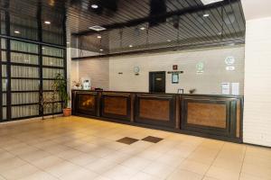 a lobby with a waiting area in a building at Everest Hotel in Etropole