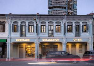 a car is parked in front of a building at Heritage Collection on KG - Mobile App Check-In in Singapore