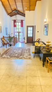 a large living room with a rug on the floor at Villa Mistora in Kandy
