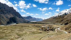 an aerial view of a village in a mountain valley at The Norbu Retreat Hull in Kaza