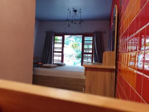 a room with a view of a bedroom with a window at Super Hostel in Nonthaburi +63 photos