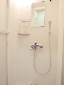 a bathroom with a shower and a sink at HOTEL LUCKY / Vacation STAY 4266 in Osaka