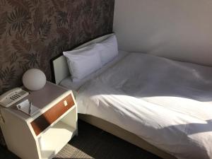 Una cama o camas en una habitación de Heal In Yokkaichi