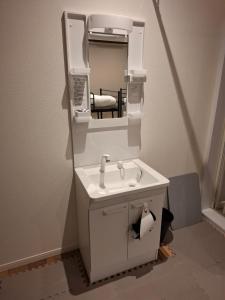 a bathroom with a sink and a mirror at Nagoya - Hotel - Vacation STAY 01596v in Nagoya