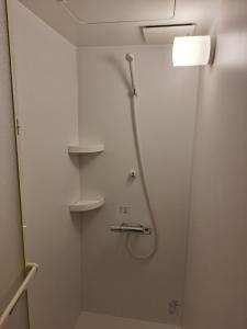 a shower stall in a bathroom with a shower head at Nagoya - Hotel - Vacation STAY 01596v in Nagoya