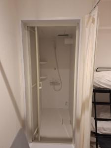 a walk in shower in a room with a closet at Nagoya - Hotel - Vacation STAY 01596v in Nagoya