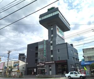 a building with a building with a sign on it at Hakodate - Hotel / Vacation STAY 34006 in Hakodate