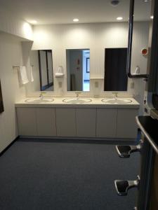 a bathroom with three sinks and two mirrors at Hakodate - Hotel / Vacation STAY 34006 in Hakodate