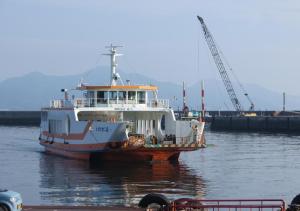a ferry boat is sitting in the water at Komecho Ryokan / Vacation STAY 36247 in Imabari